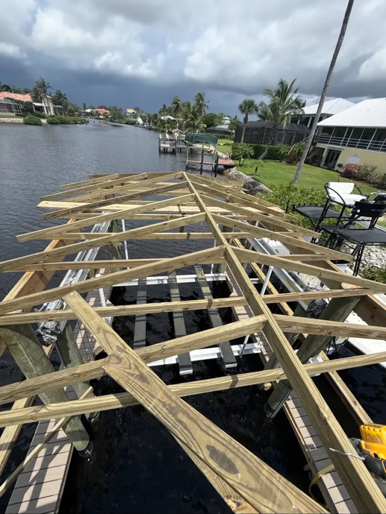 Photo of a boat house roof being constructed on a dock by Overall Outdoor & Marine Services for a government job.