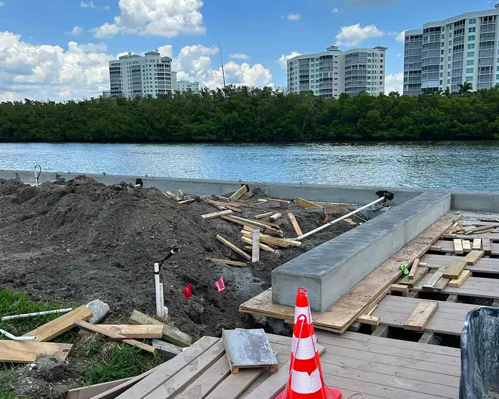 Seawall Repair vs. Replacement: What You Need to Know. Featuring an image of a seawall under reconstruction, as performed by Overall Outdoor & Marine Services.